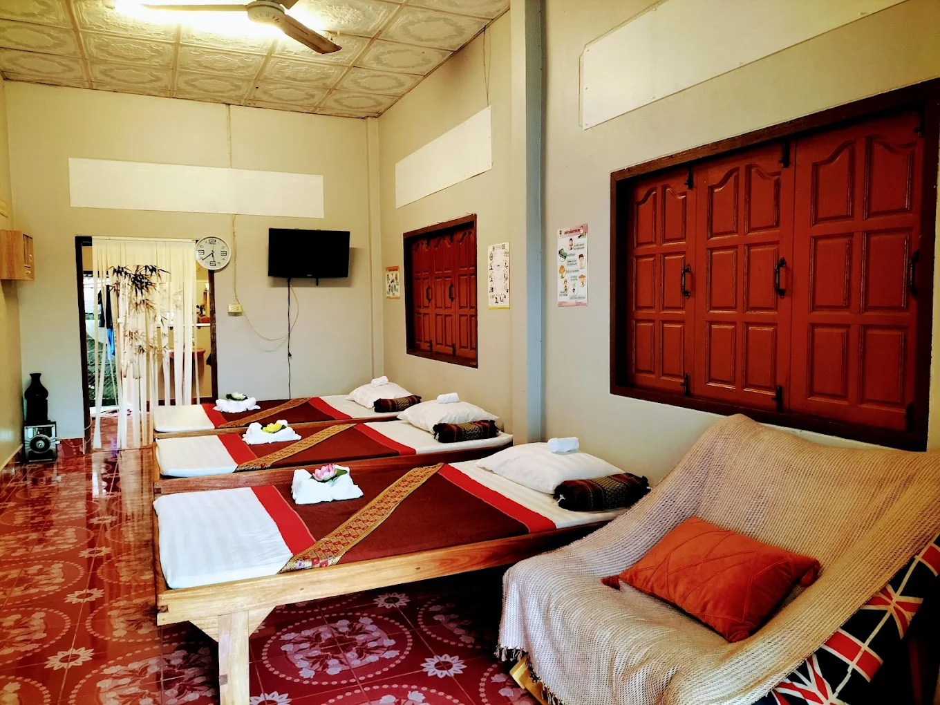 Clean massage beds with Thai textile details